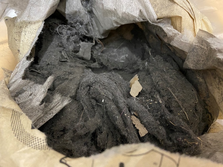 Collected dust in container